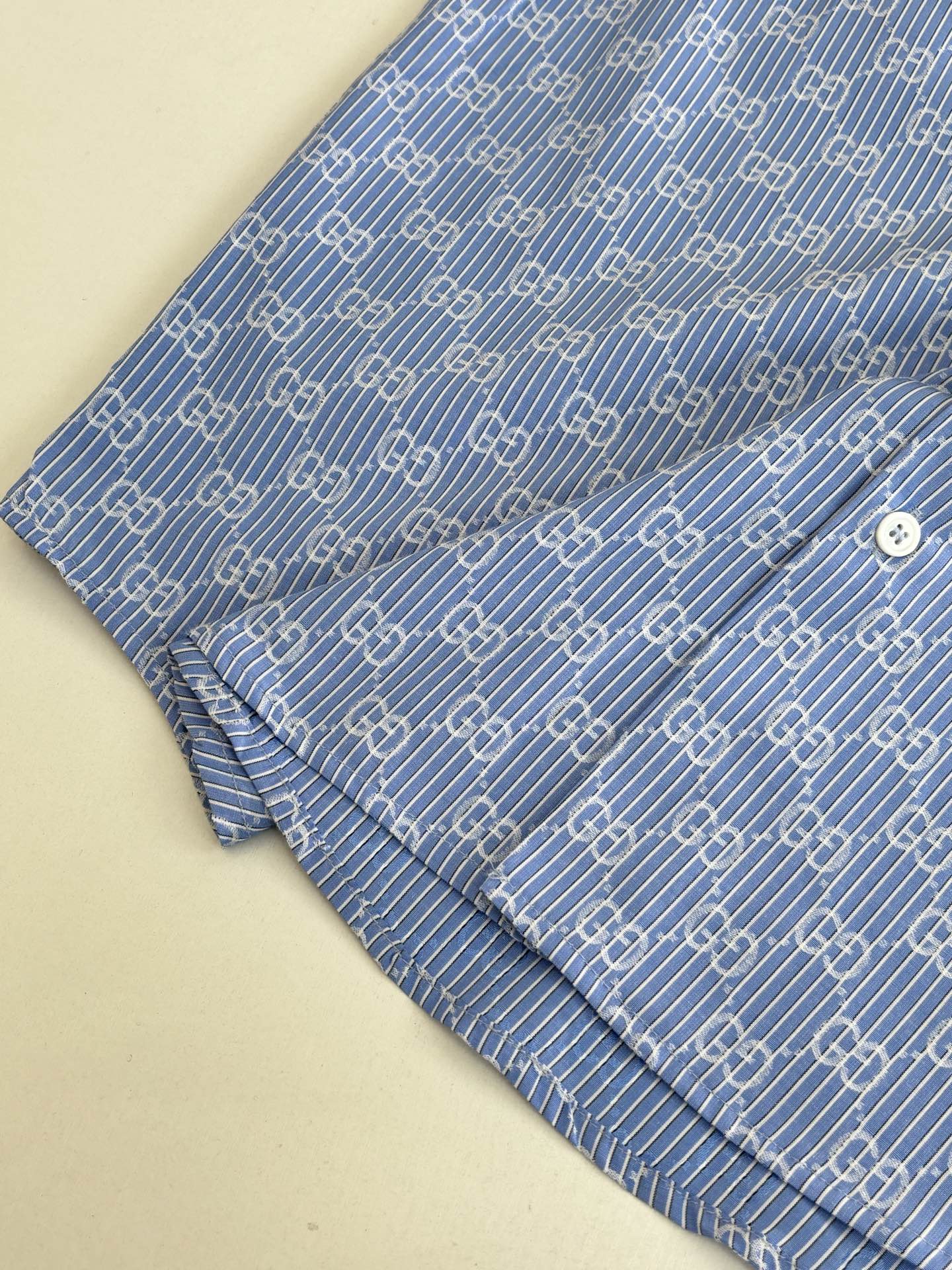 Blue Gucci long-sleeve shirt sleeve with cuff and allover logo pattern