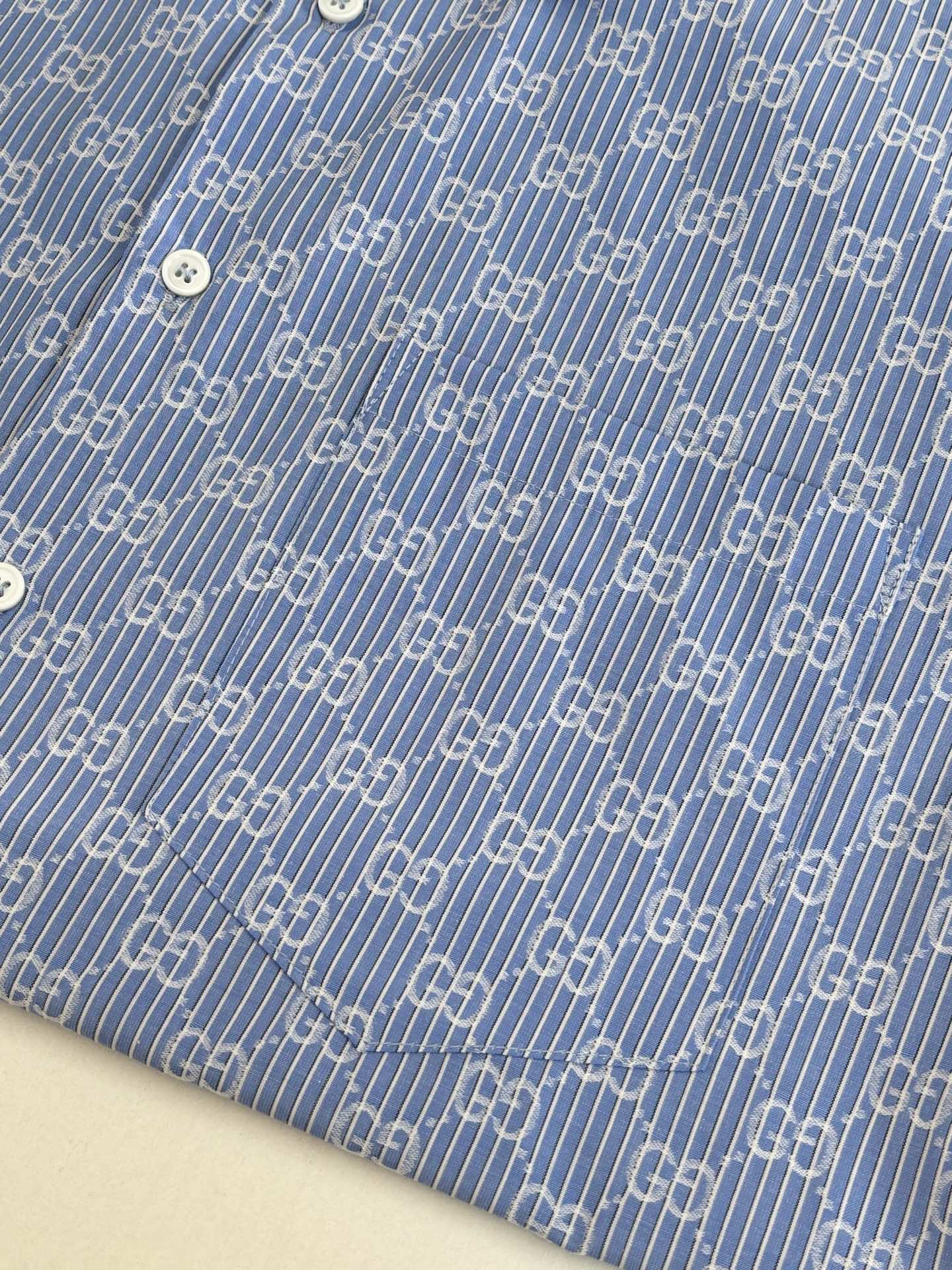 Blue Gucci long-sleeve shirt fabric with allover logo pattern and white buttons