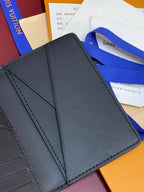 Small leather card holder wallet, close-up of inner pocket, dark blue-gray