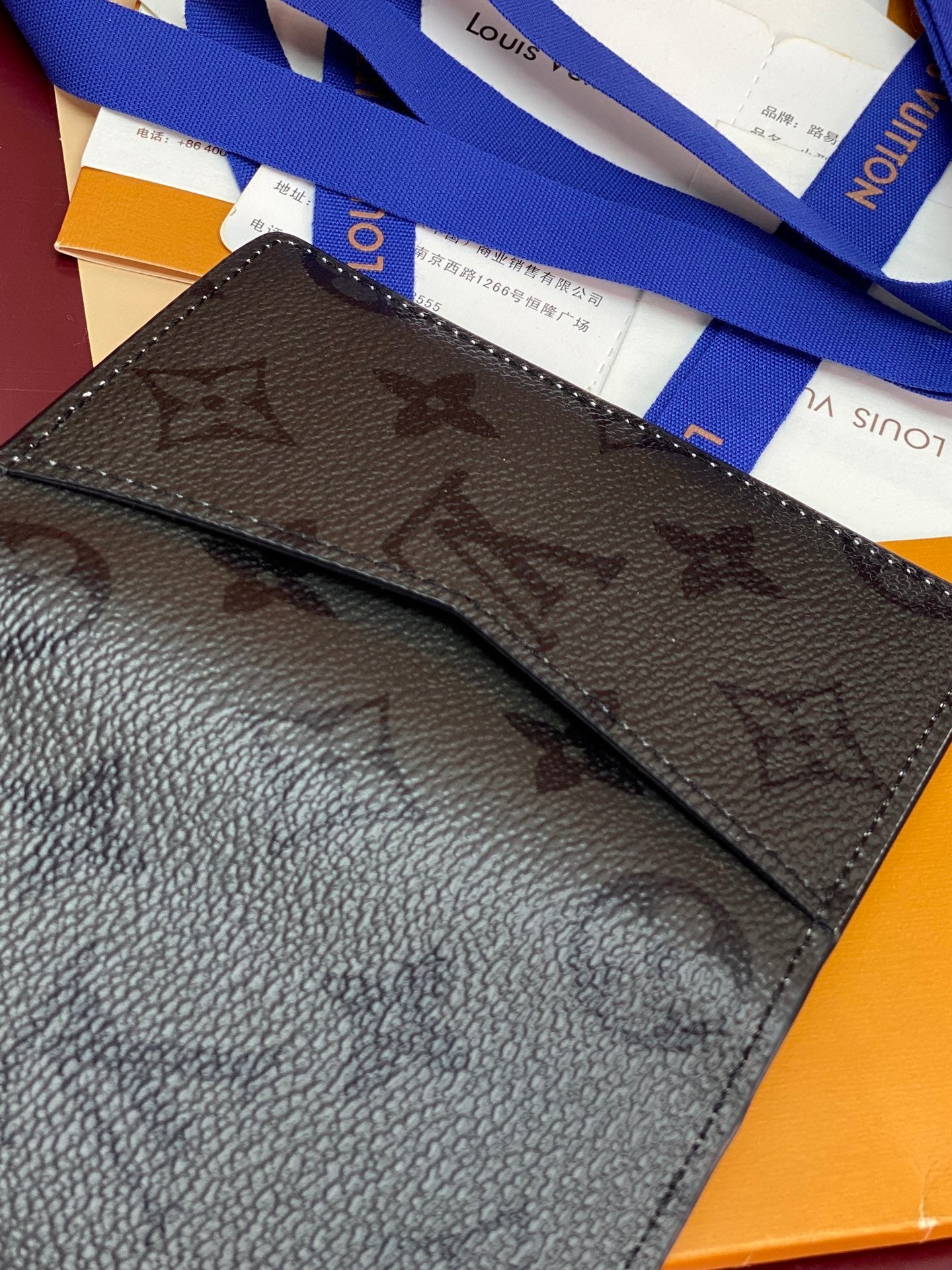 Small leather card holder wallet, monogram pattern, dark brown with blue ribbon