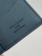 Small leather card holder wallet, close-up of Louis Vuitton logo and made in France