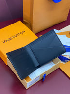 Compact wallet in blue leather with interior card slots and stitched borders