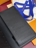 Small wallet bag exterior with card slot panel detail, dark leather finish