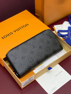 Small zip pouch with embossed monogram pattern, black, zipper closure