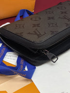 Small zip pouch with monogram front panel, black zipper, metal pull tab