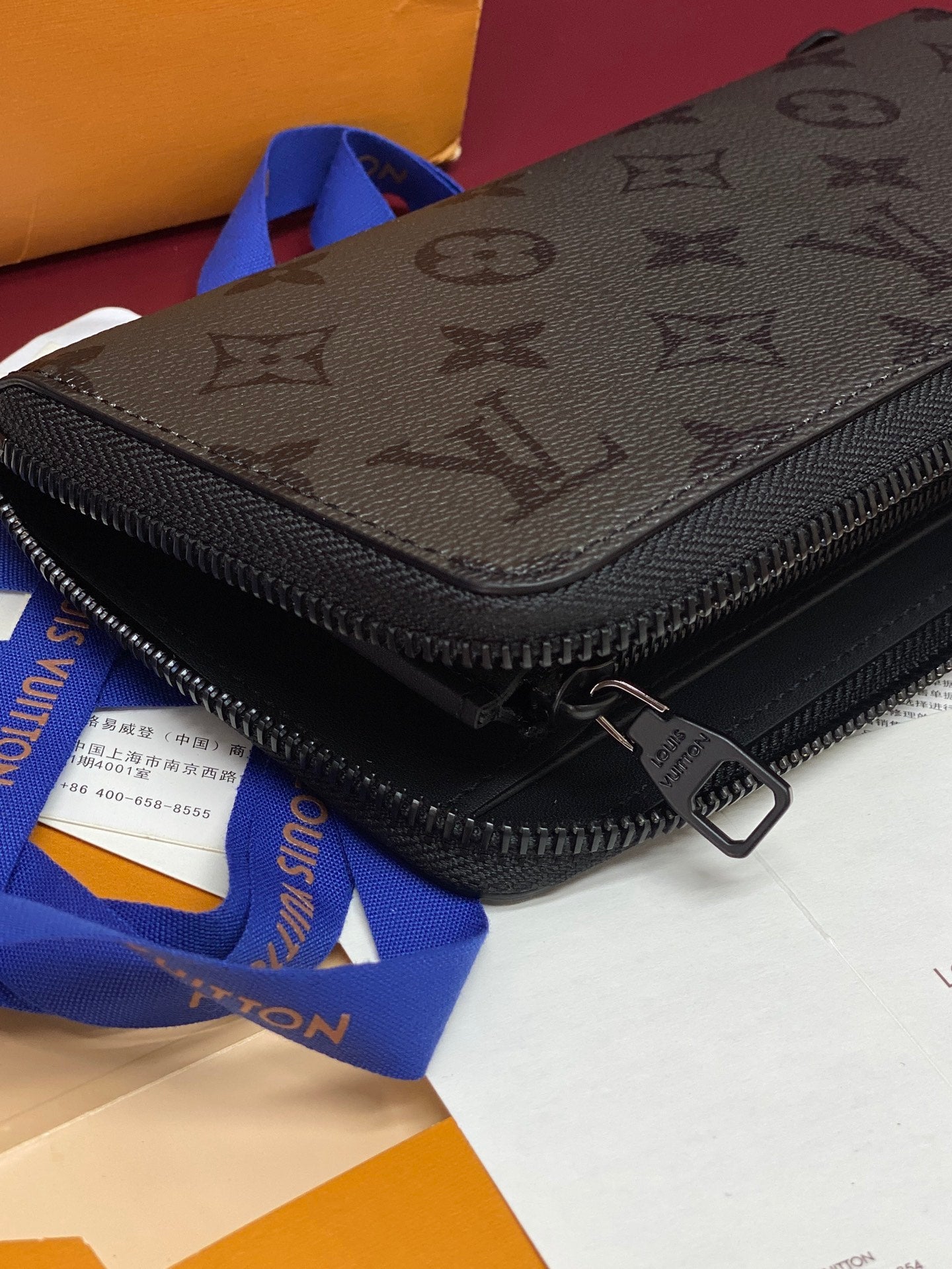 Small zip pouch with monogram front panel, black zipper, metal pull tab