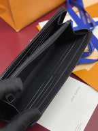 Small zip pouch open view, black lining and zipper track, monogram exterior