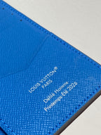 Small bag card holder close-up of Louis Vuitton Paris text on blue leather