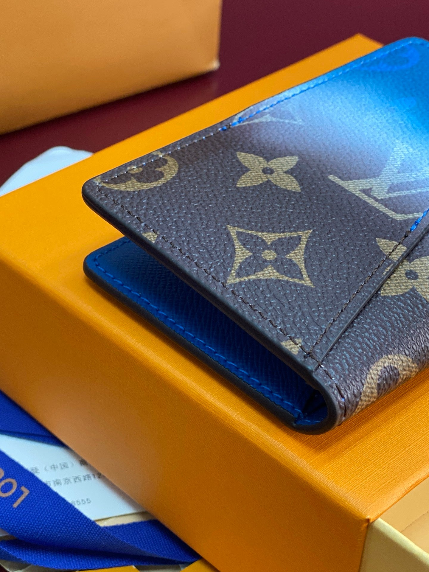 Small bag card holder with Louis Vuitton monogram flap and blue leather underside