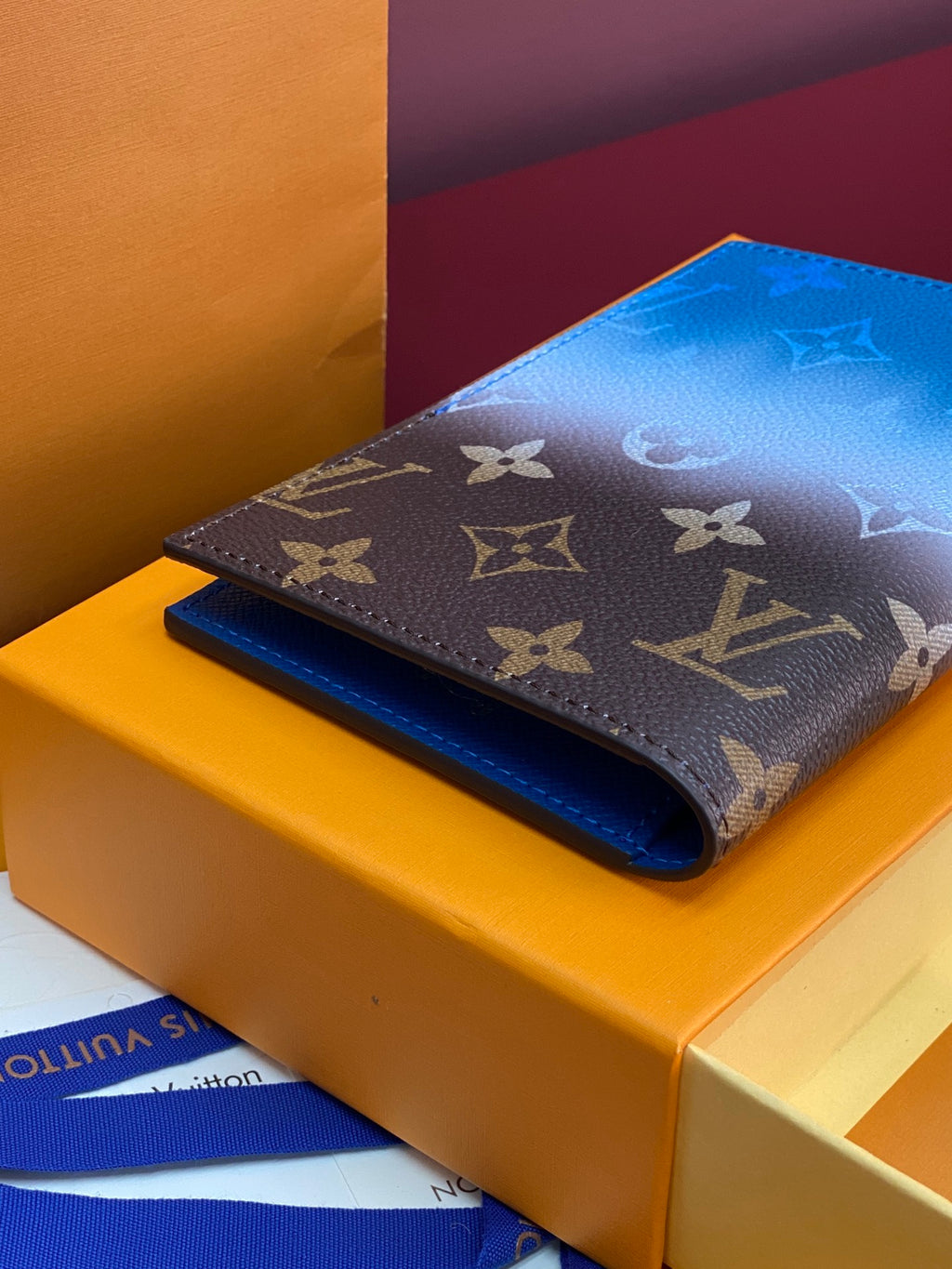 Louis Vuitton small bag with dark brown monogram exterior and blue lining