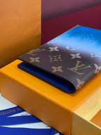 Louis Vuitton small bag with dark brown monogram exterior and blue lining