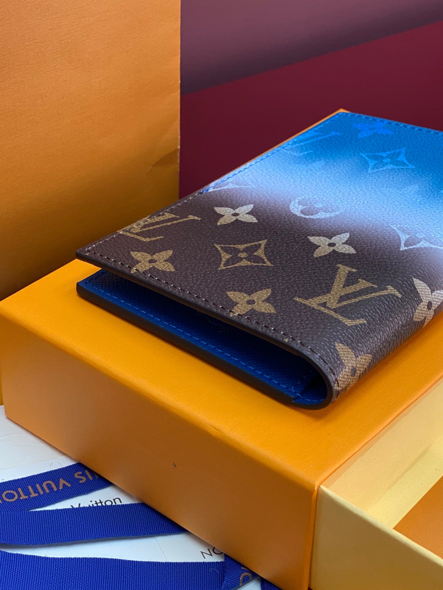 Louis Vuitton small bag with dark brown monogram exterior and blue lining