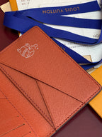 Louis Vuitton small wallet back close-up with embossed emblem and stitched fold