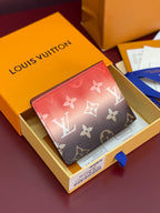 Small Louis Vuitton monogram card wallet with blue ribbon, red and dark brown