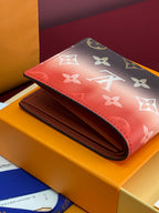 Small Louis Vuitton monogram wallet with open billfold, red and dark brown