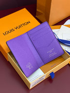 Small bag card holder with purple leather exterior and card slots on interior view