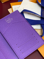 Purple small bag with Louis Vuitton monogram-style logo on front flap