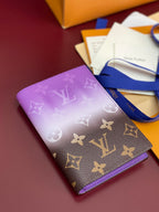Purple small bag with Louis Vuitton monogram and blue wrist strap