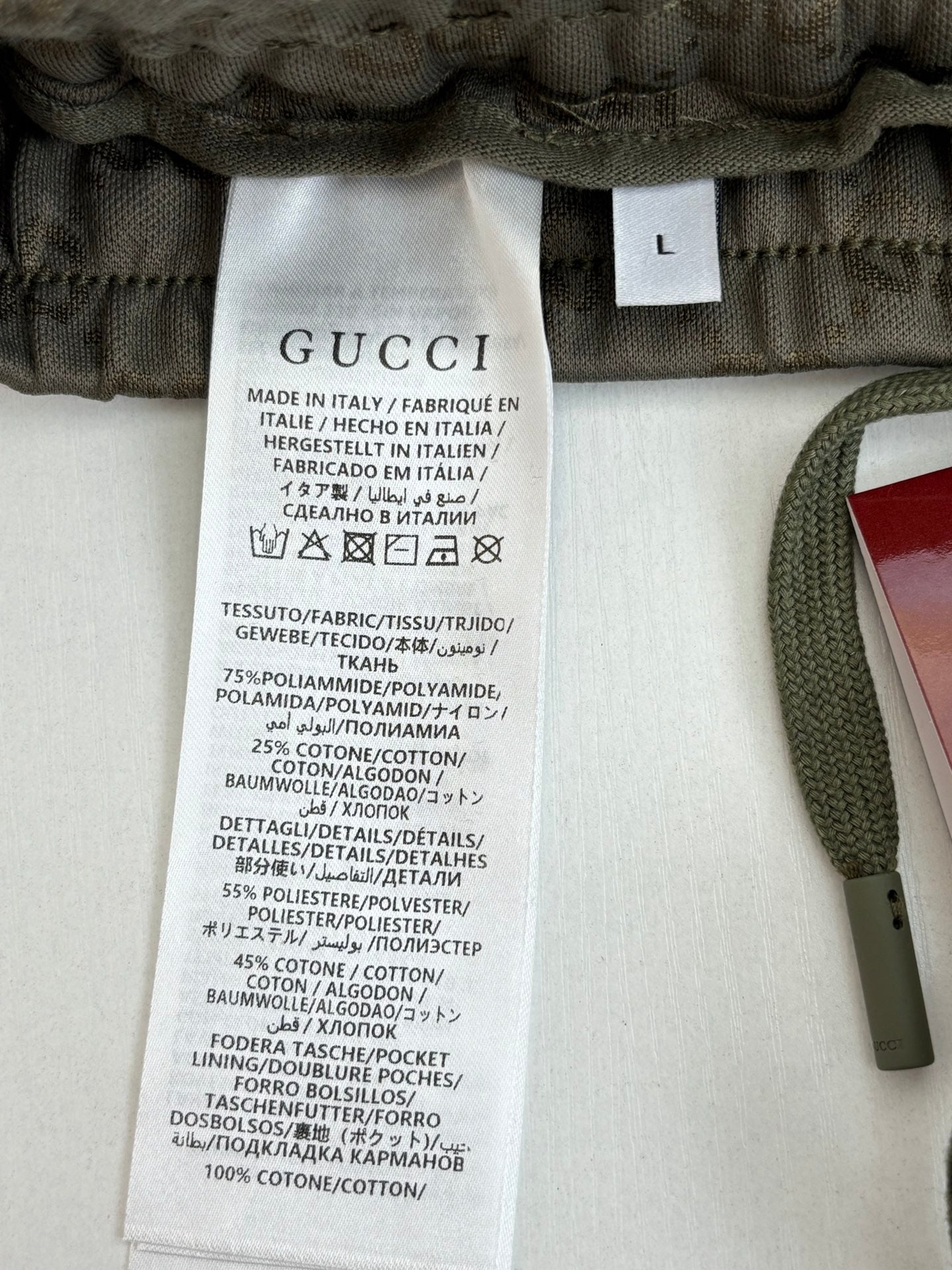 Gucci shorts care label inside waistband, dark olive