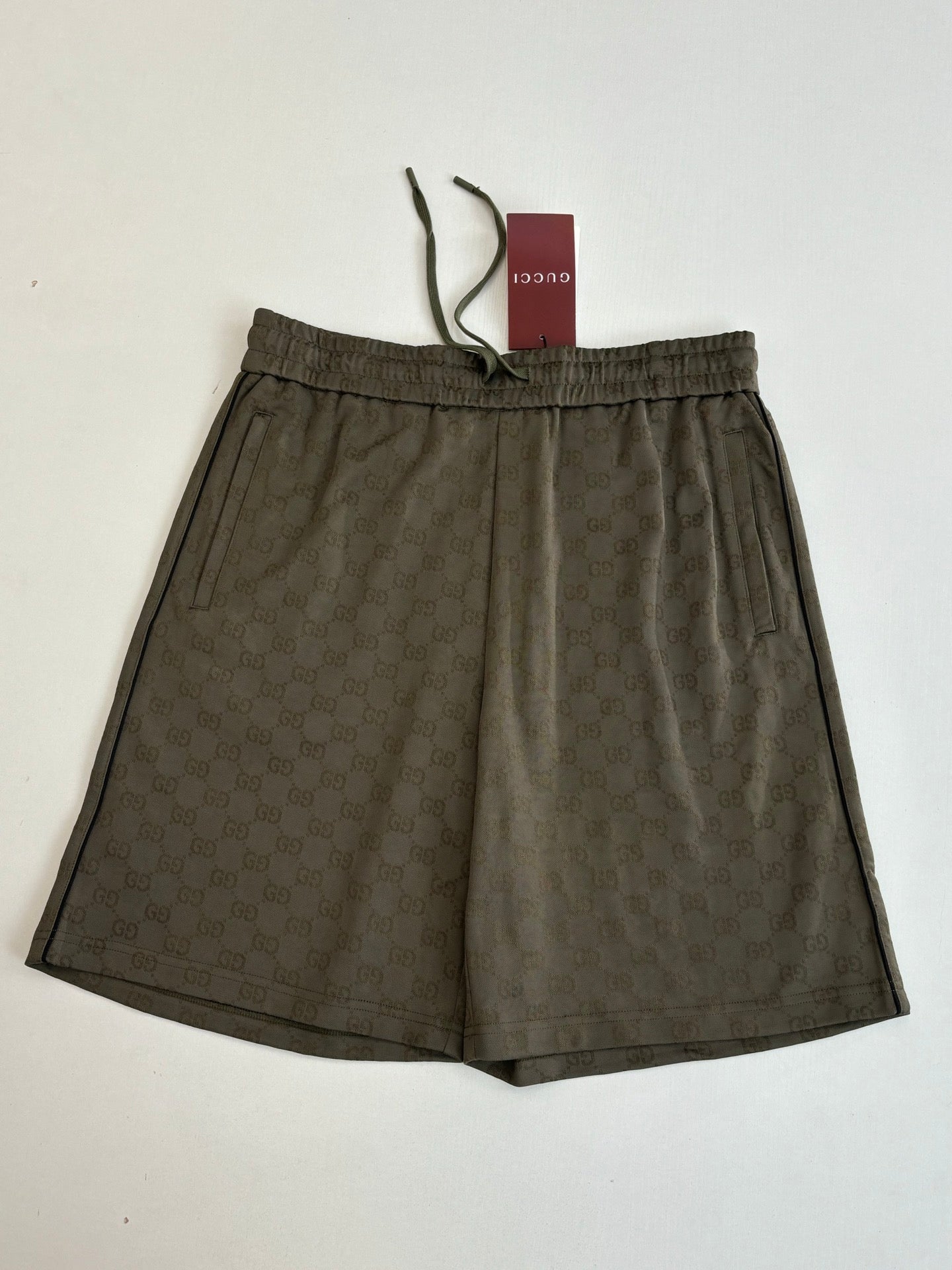 Gucci monogram shorts with elastic waist and pleated front, dark olive