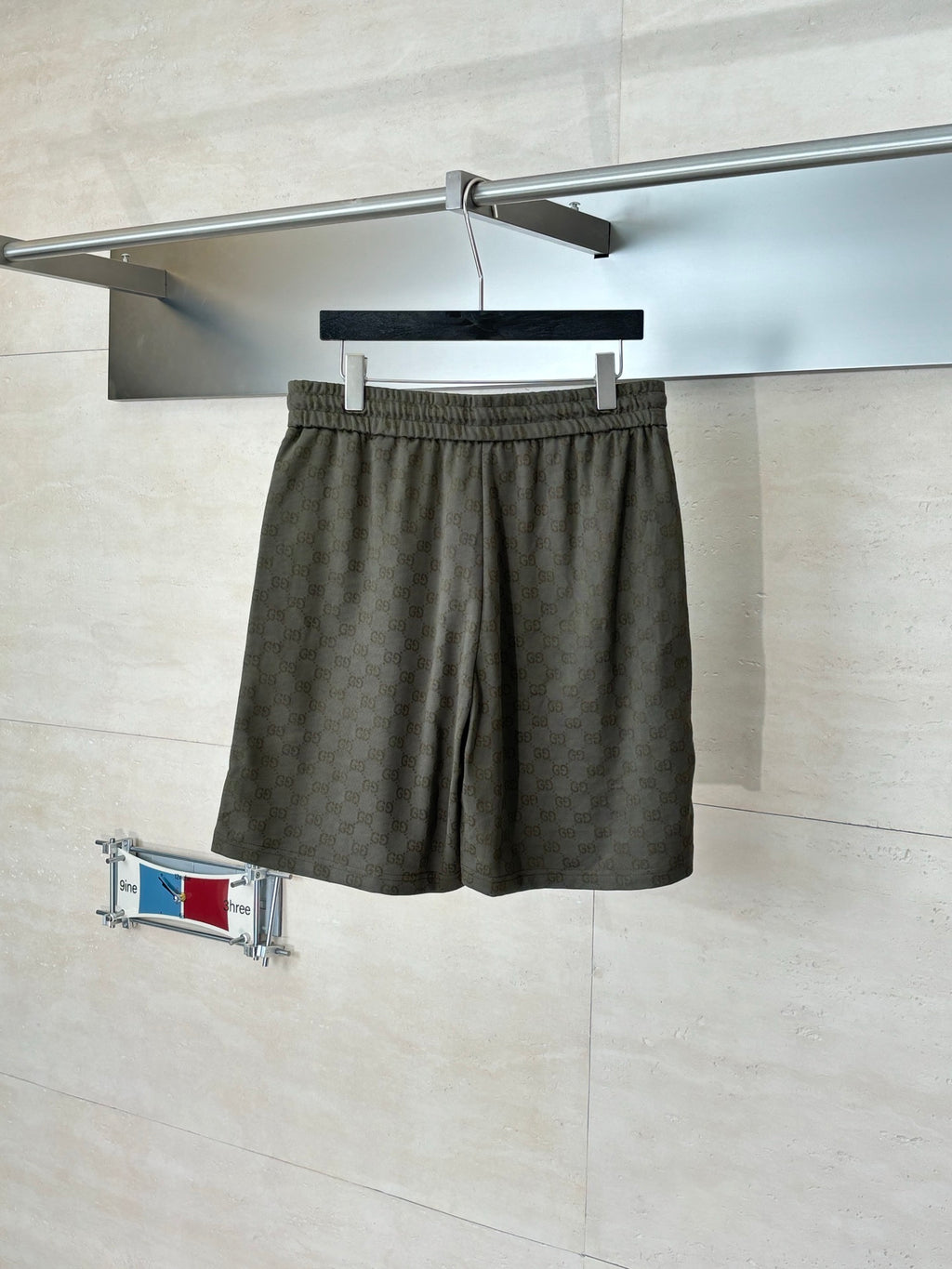 Gucci monogram shorts with elastic waist, dark olive, draped front