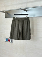Gucci monogram shorts with elastic waist, dark olive, draped front