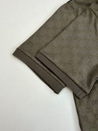 Gucci monogram shorts hem with dark olive fabric and black stripe detail