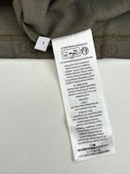 Gucci short care label on olive fabric