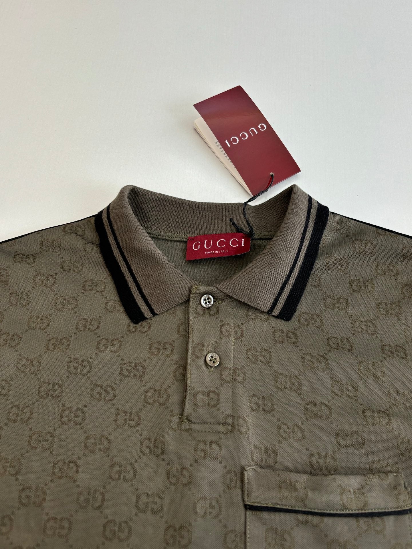 Gucci monogram polo shirt neckline with button placket and chest pocket, dark olive