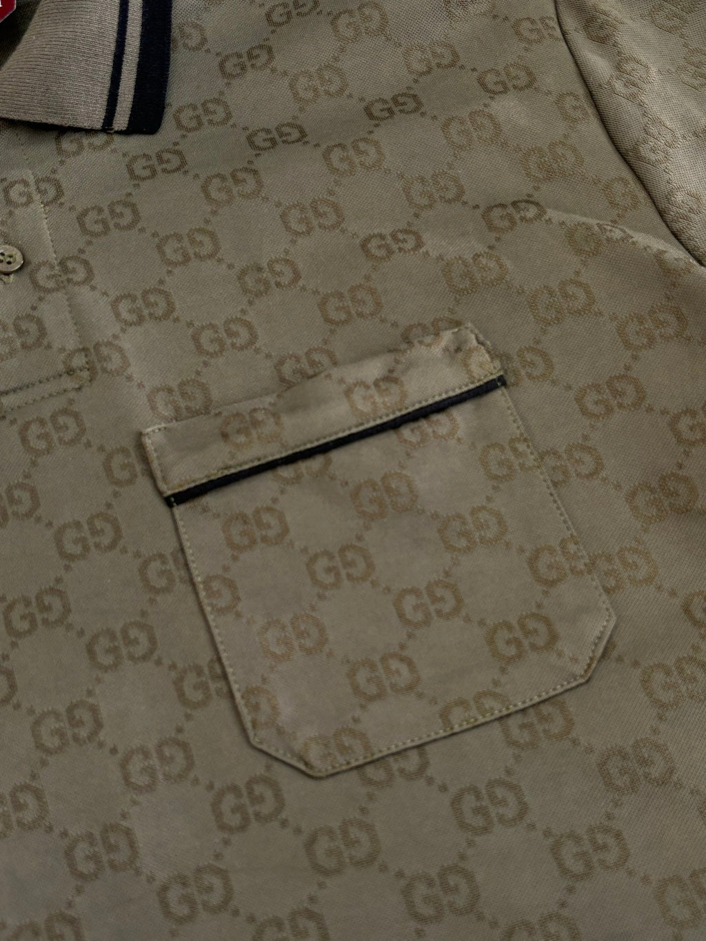Gucci monogram polo shirt detail with chest pocket and buttons, dark olive