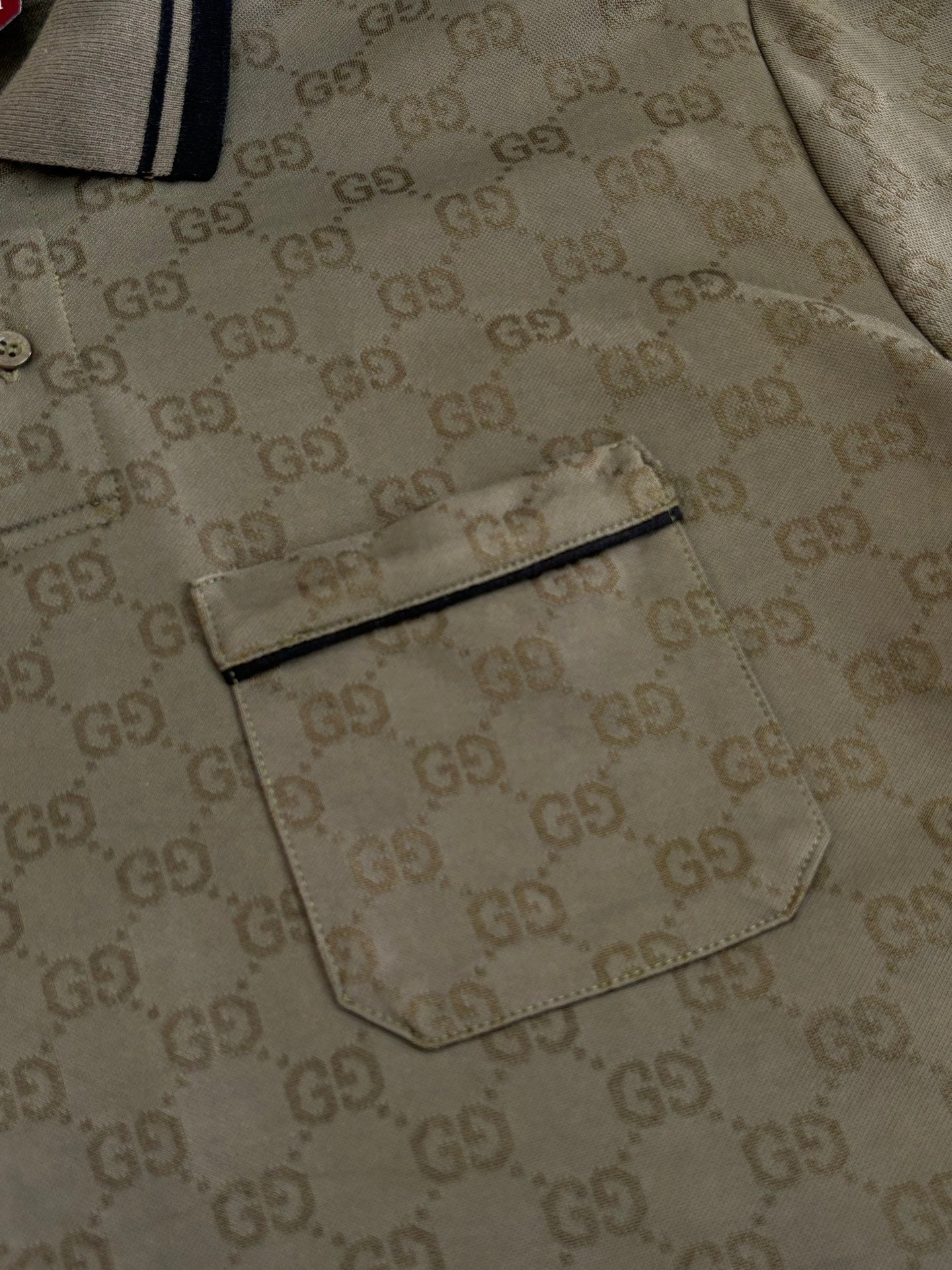 Gucci monogram polo shirt detail with chest pocket and buttons, dark olive