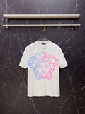White T-shirt with blue and pink Medusa-style graphic on the chest, crew neck.