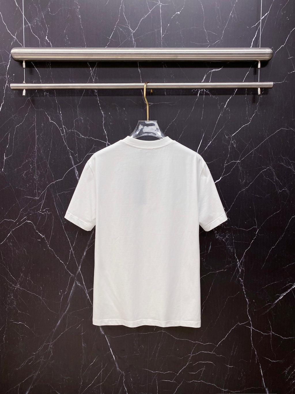 White T-shirt, back view, short sleeves and crew neck.