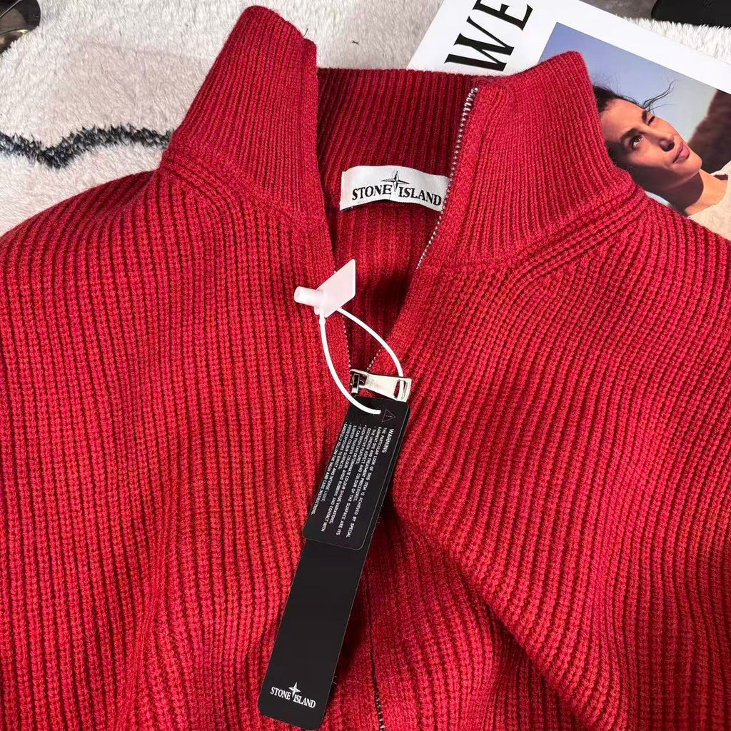 Red knit sweater collar close-up with front zipper and Stone Island logo tag