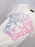 White T-shirt with large blue and pink Medusa face graphic on front