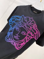 Versace T-shirt in dark navy with large blue, purple, and pink face graphic