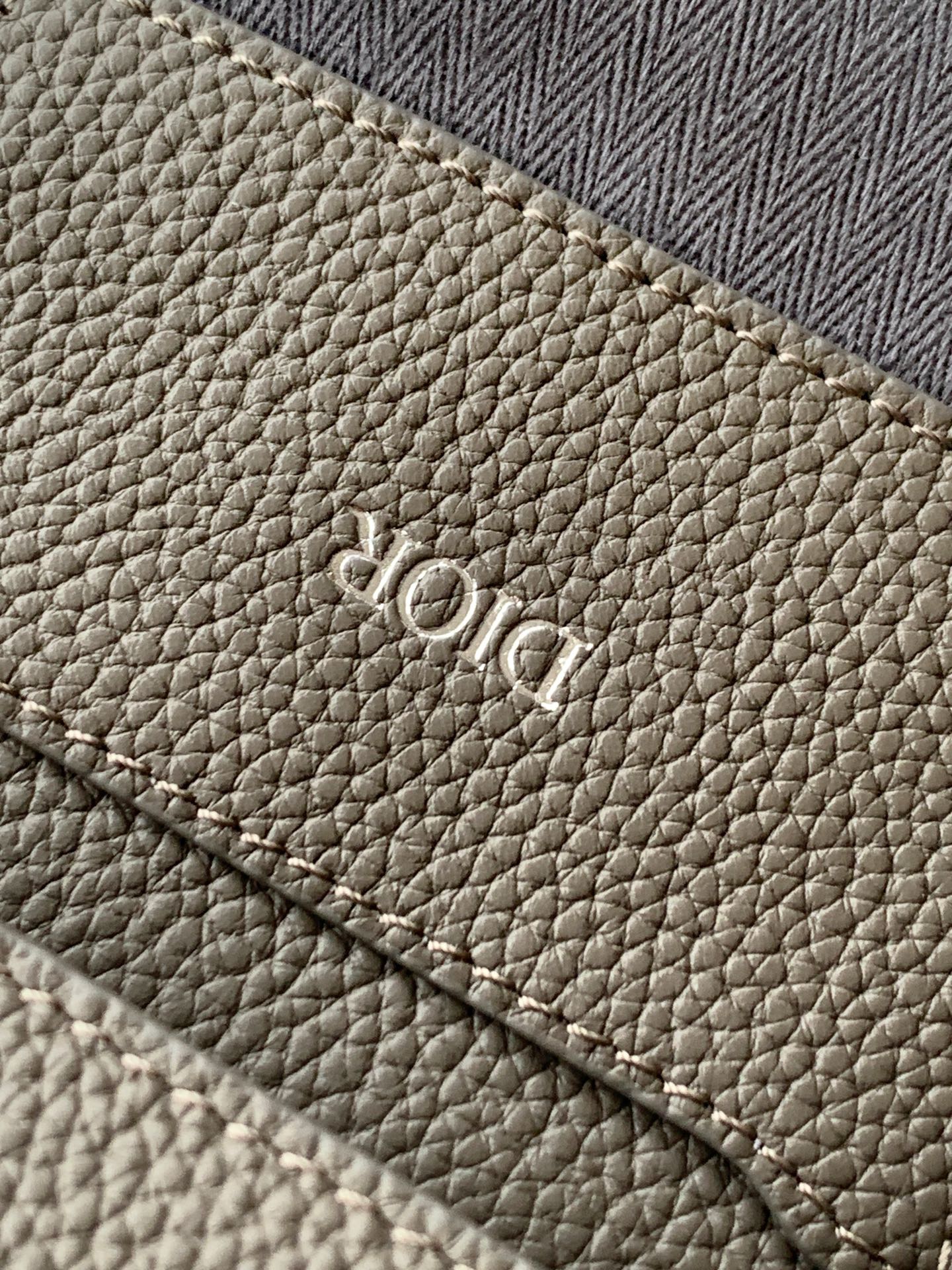 Taupe textured leather Dior stamp on small pouch bag