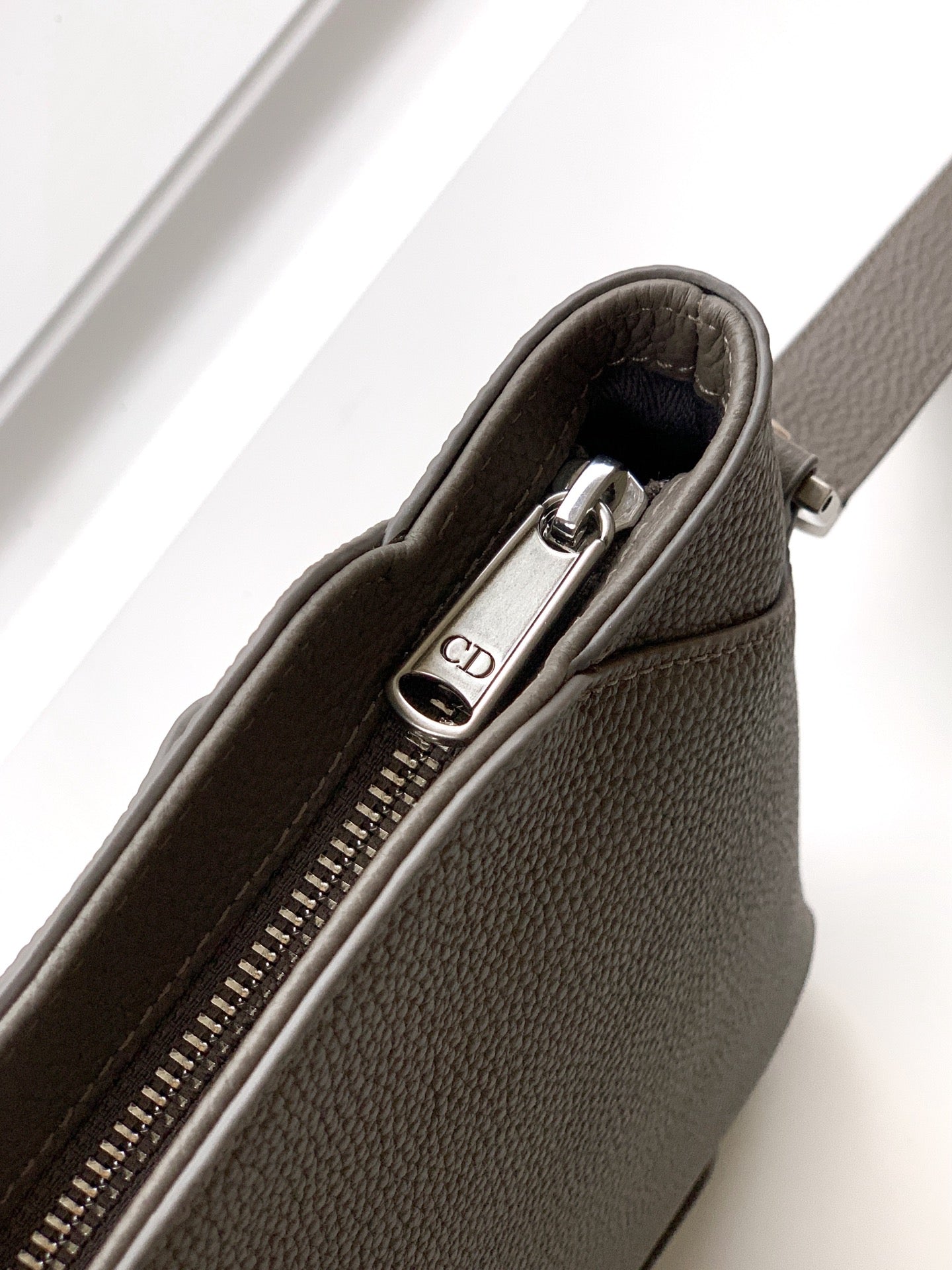 Taupe leather Dior men's small pouch bag zipper pull with CD charm