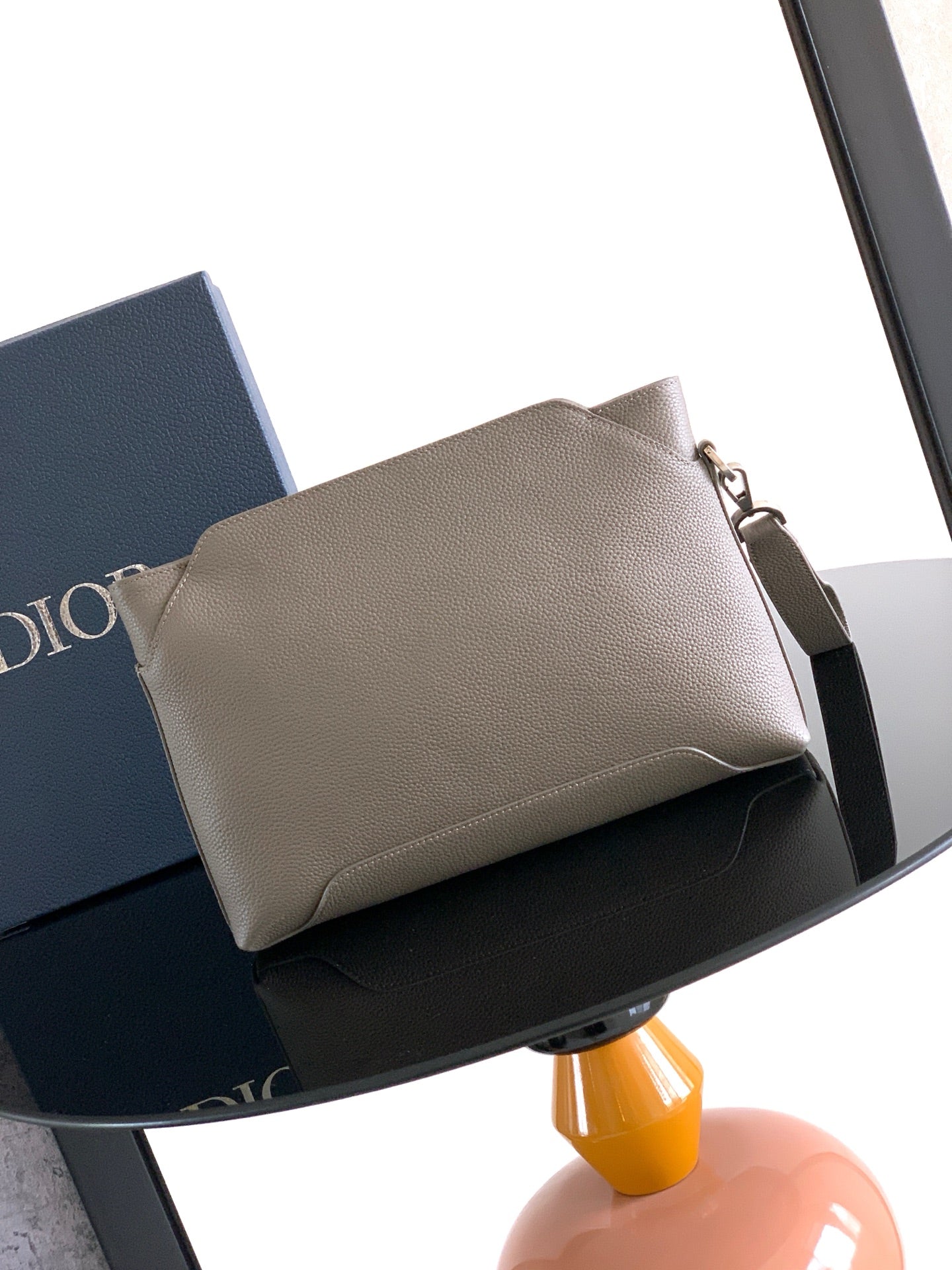 Taupe leather Dior men's small pouch bag with top zipper and shoulder strap