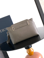 Taupe leather Dior men's small pouch bag with zipper and strap D-ring