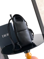 Dior backpack bag shown from the side with adjustable shoulder straps
