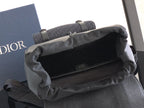 Dior backpack with open top and fabric lining, showing the main compartment interior.