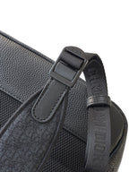 Dior backpack bag close-up of strap adjuster with embossed logo trim