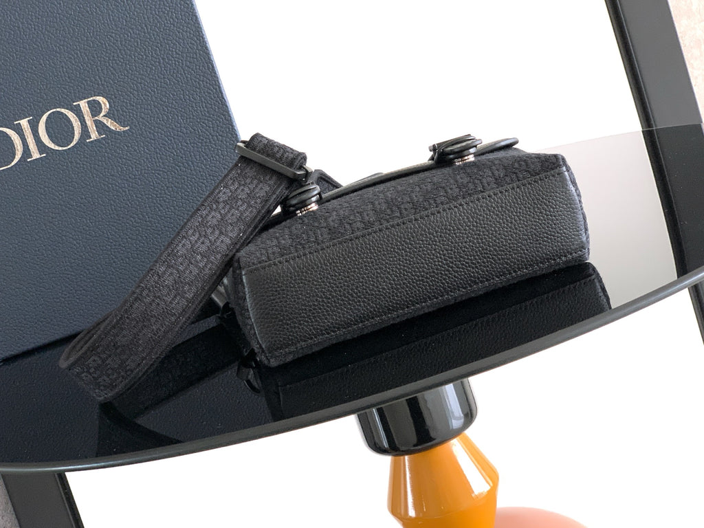 Dior bag with shoulder strap, dark leather flap and metal buckles