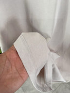 Louis Vuitton light gray T-shirt fabric close-up with side seam stitching