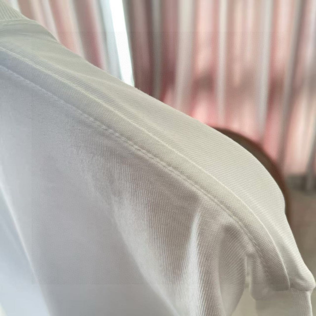 Louis Vuitton white T-shirt sleeve seam and textured fabric closeup