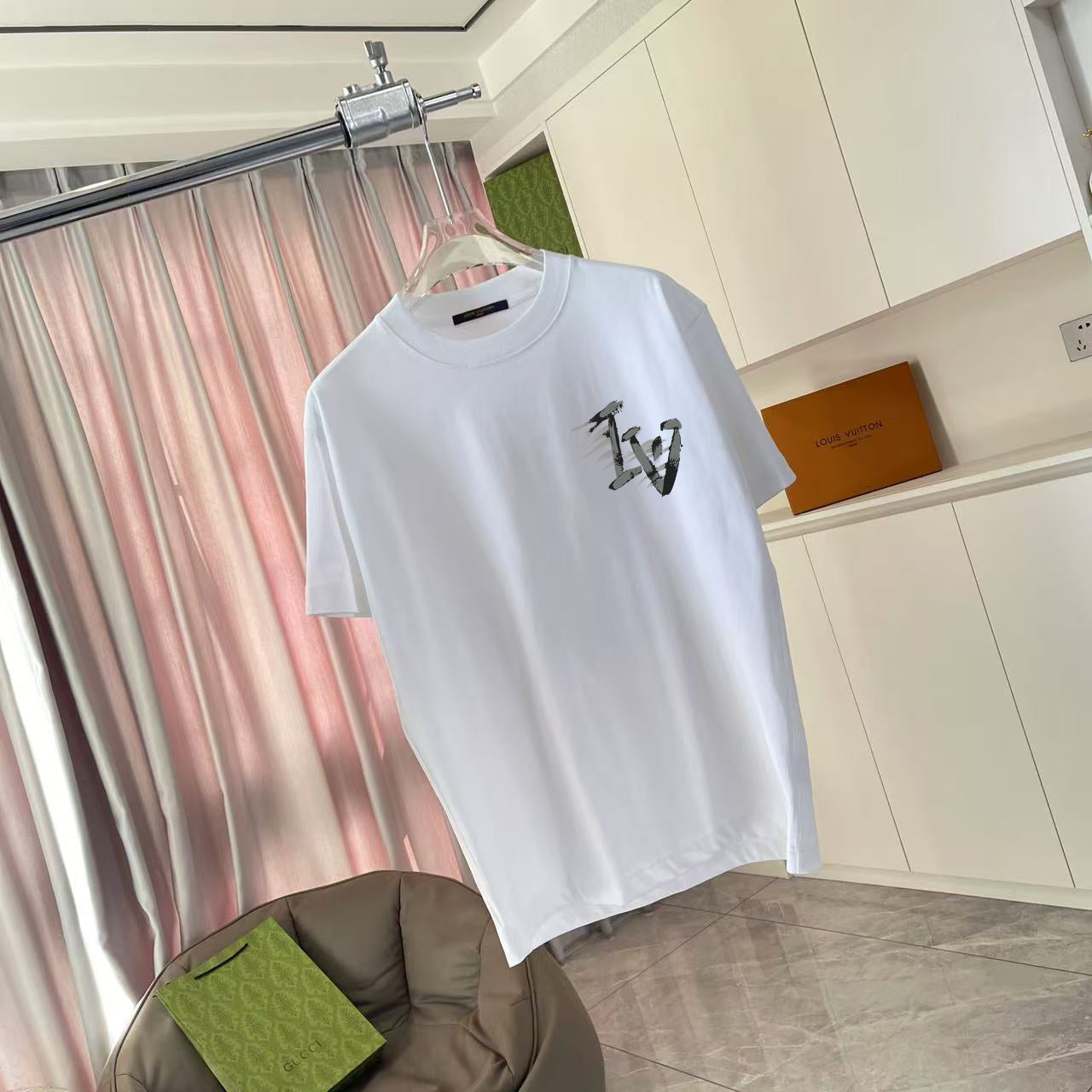 Louis Vuitton white short-sleeve T-shirt with black chest graphic logo, front view