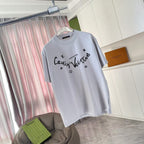 Light gray T-shirt with centered logo script print and small icon motifs
