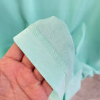 Louis Vuitton turquoise T-shirt fabric texture and stitched edge detail