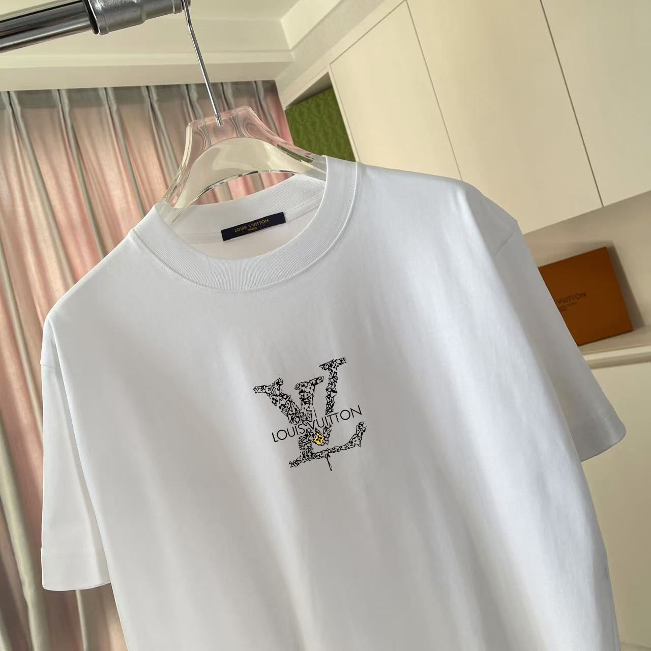 Louis Vuitton white T-shirt with black LV-style logo on chest